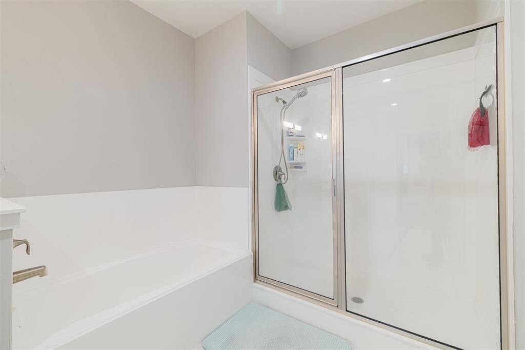 Primary bath features a soaking tub and separate walk-in shower.