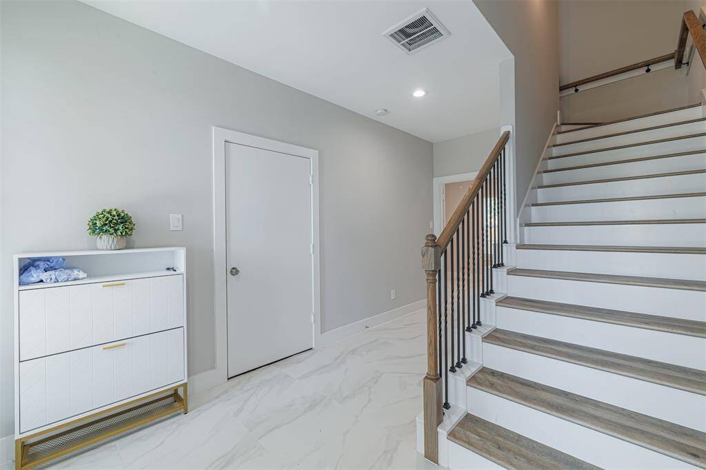 Front entry. Door seen in picture leads to the garage.