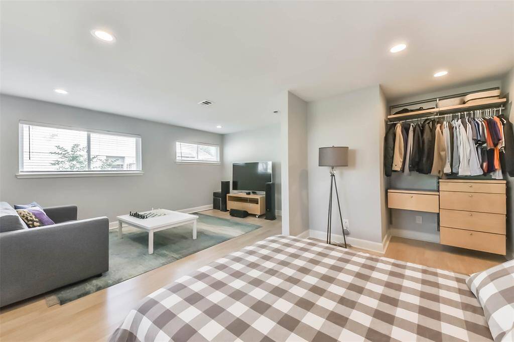 The layout of this secondary bedroom invites you to use it as retreat for watching TV or for reading a book.