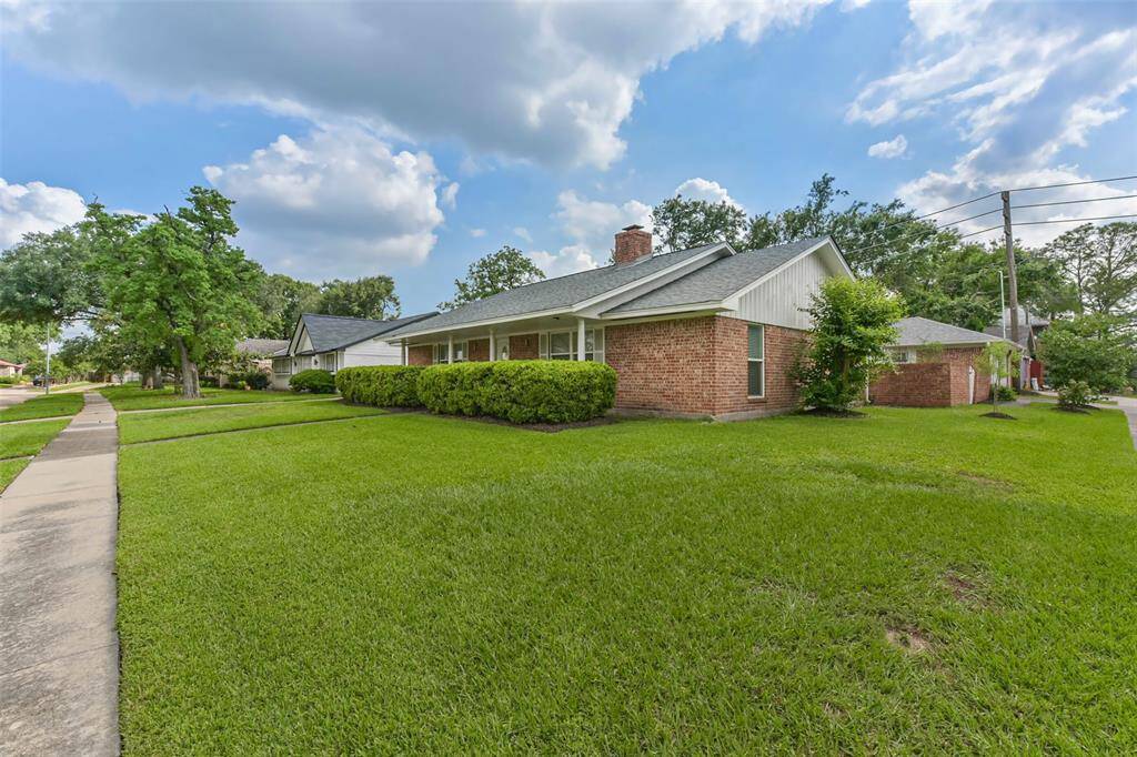 This angle view illustrates the generous size of the corner lot on which the property is located.