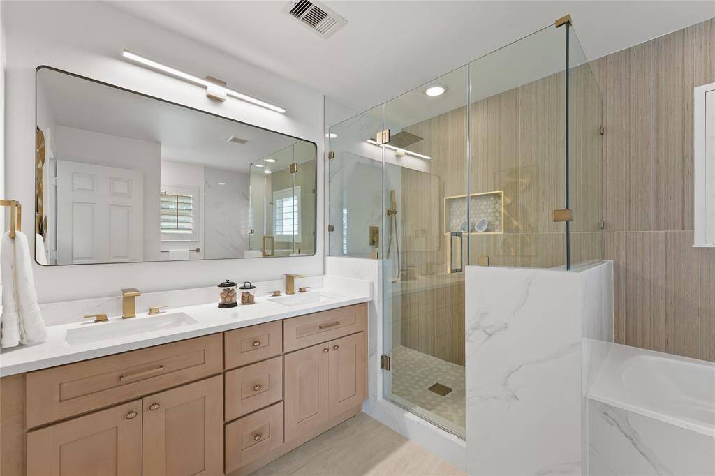 Primary Bath Completely Remodeled with New Quartz Counters, New Lighting and Fixtures