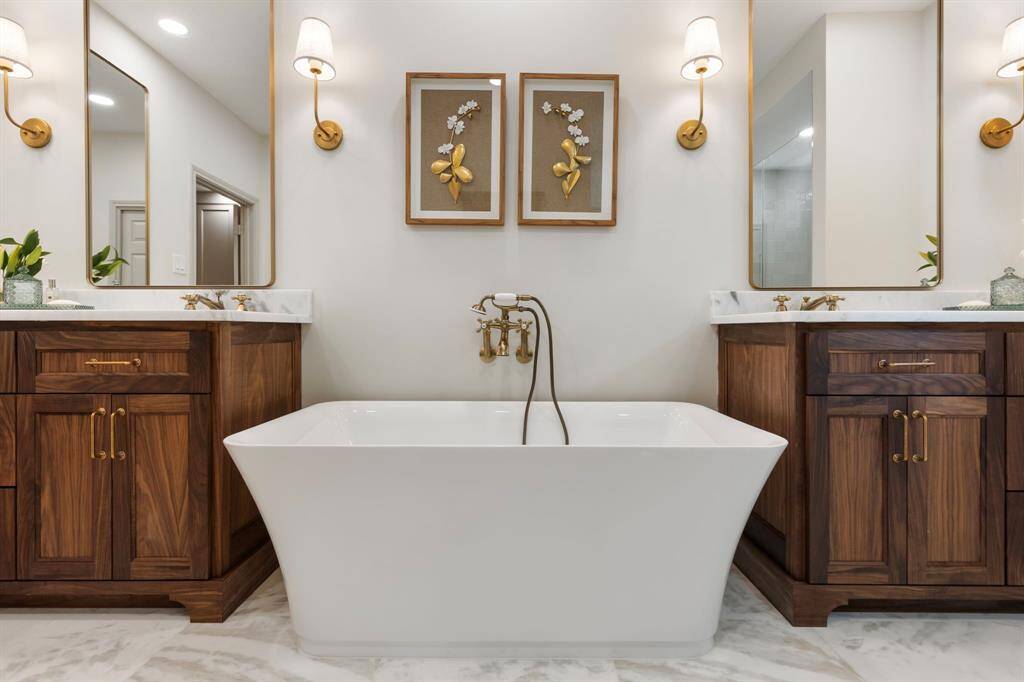 Large soaking tub with brass fixtures