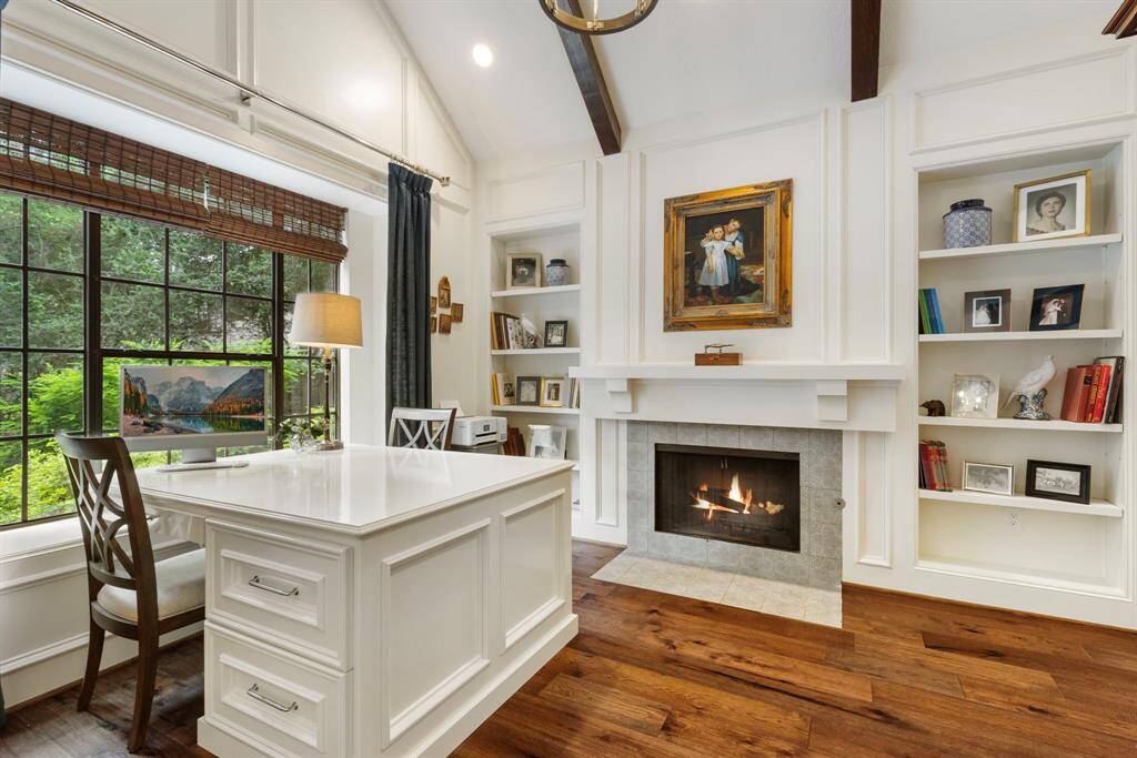 Double-sided built-in desk with gas log fireplace