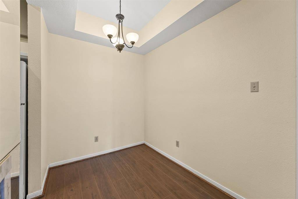 Cozy dining nook with a stylish tray ceiling, ready for everyday meals or intimate gatherings