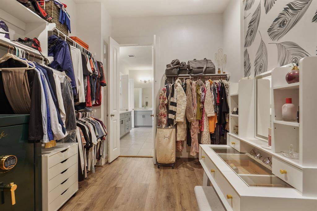 View from the back of the closet with custom wallpaper