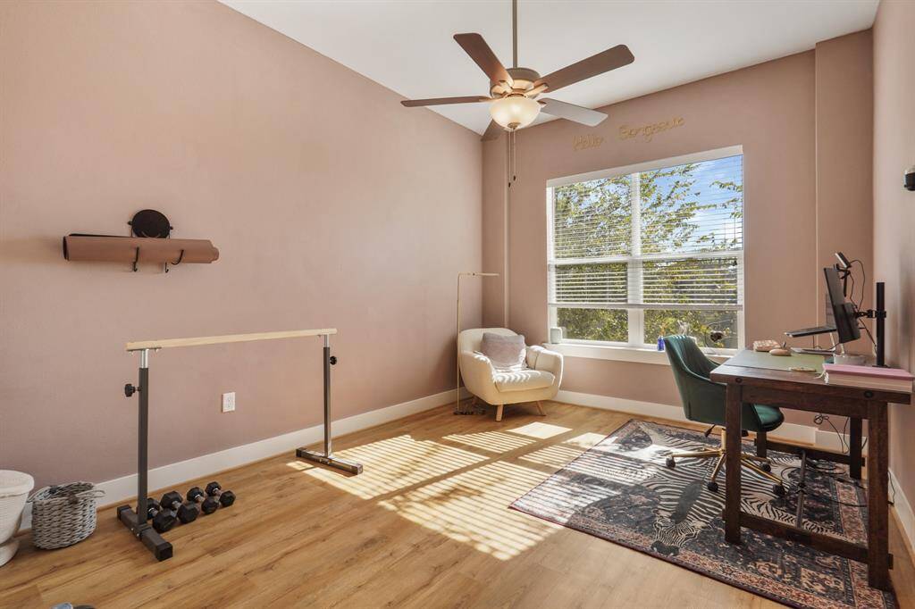 2 of 2 secondary bedrooms currently being used as an office/workout space