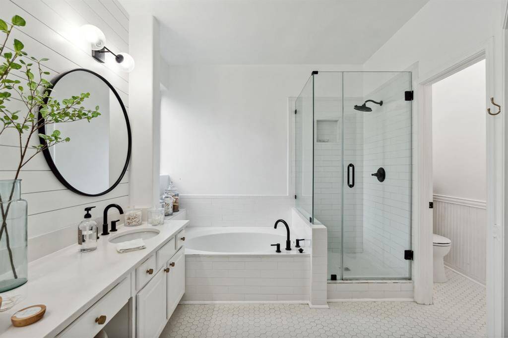 The primary bathroom also has a walk-in shower and separate garden tub.