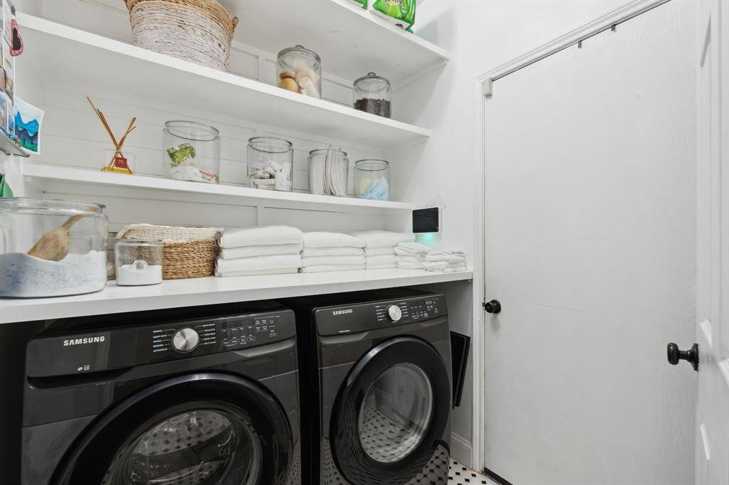 The laundry room features tile floors,washer and dryer connections, andplenty of storage space.