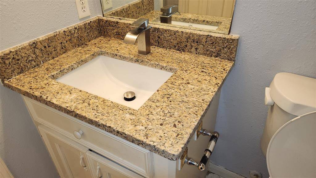2nd bath with tile, sink with granite counter top and shower tub