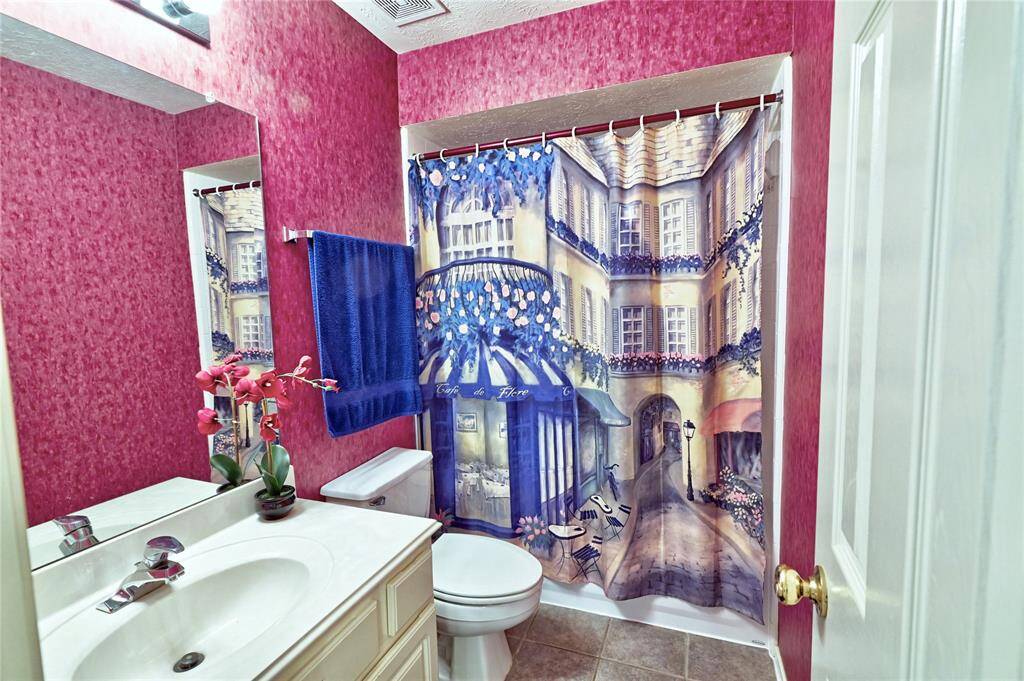 The first of two full bathrooms on second floor. It includes a toilet, sink, with shower/ tub combo.