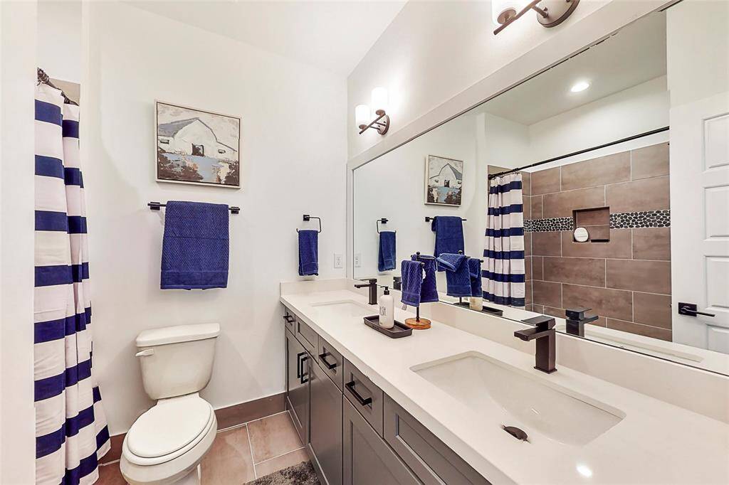 Ensuite bathroom - third floor. Quartz countertops and shower/tub! Photos from another community by the same builder, FINISHES & COLORS MAY VARY!