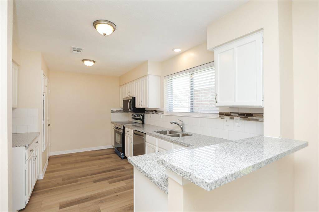 view of kitchen from den