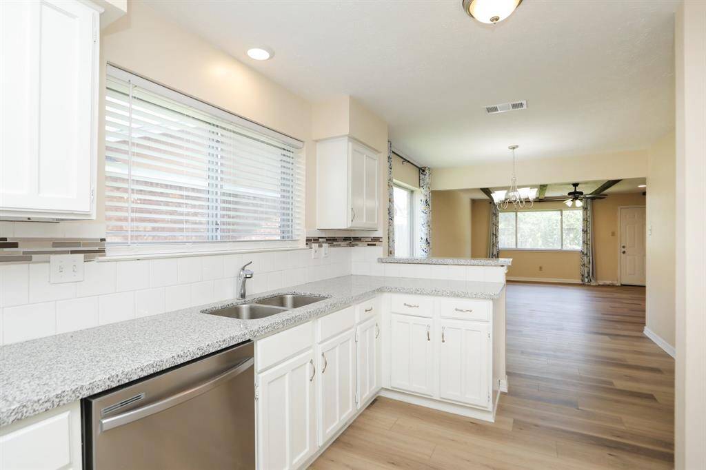 view of kitchen to den