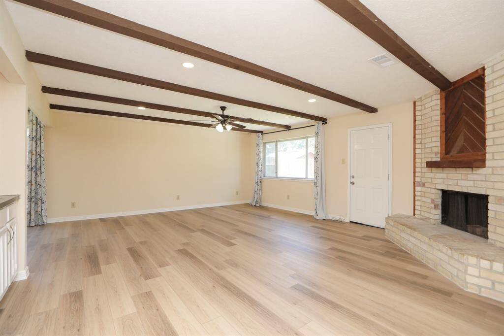 den with wood burning fire place