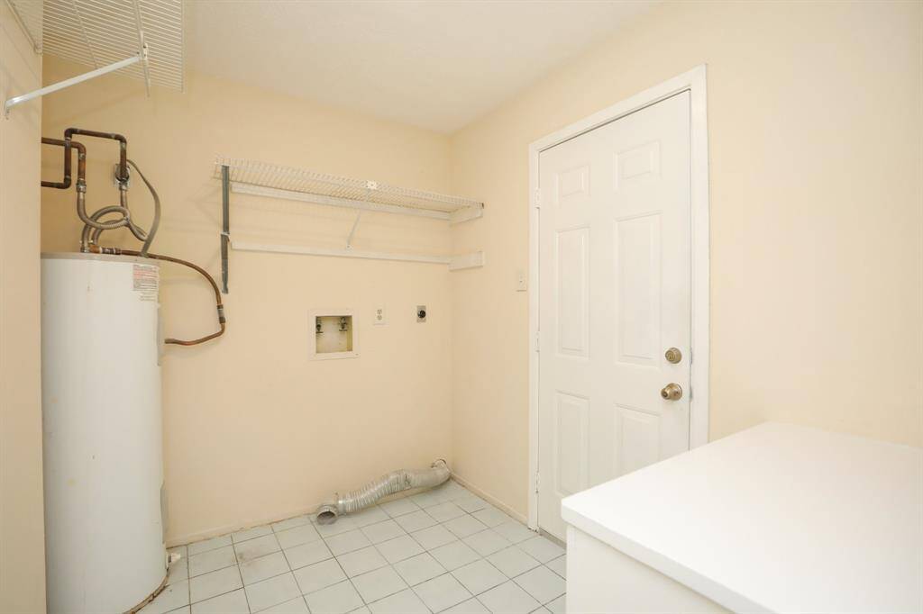 very large utility room with built in storage and folding area