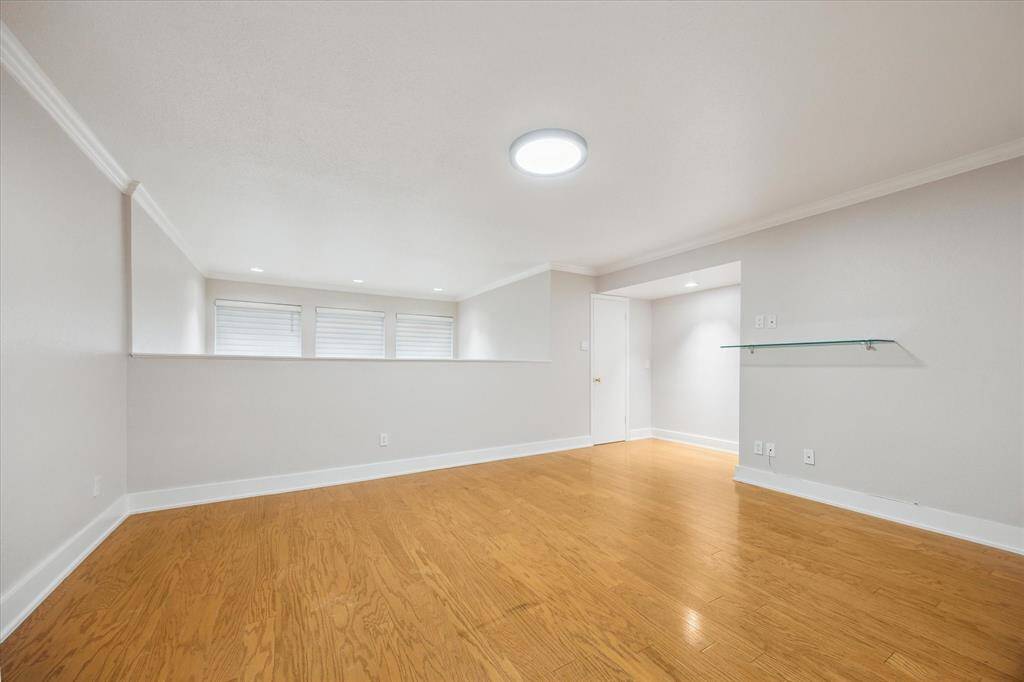 The Primary Bedroom has an indoor balcony that looks below. There are 2 walk in closets