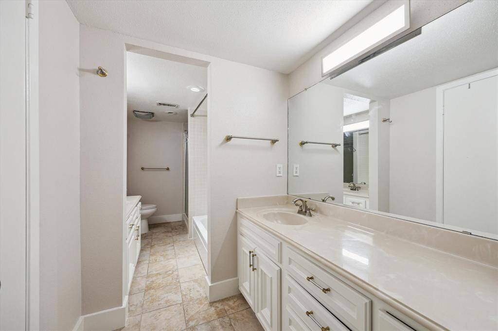 The Primary Bath has 2 vanity areas, separate shower and tub.