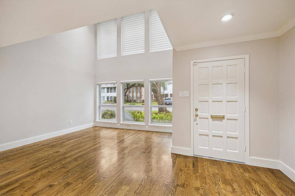 The Entry opens into the Living and Dining areas.. Dramatic 2 story wall of windows!