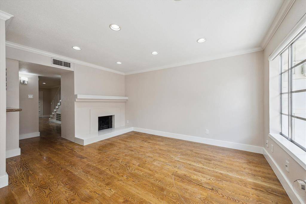 The Family room has fireplace and access to the private back patio,
