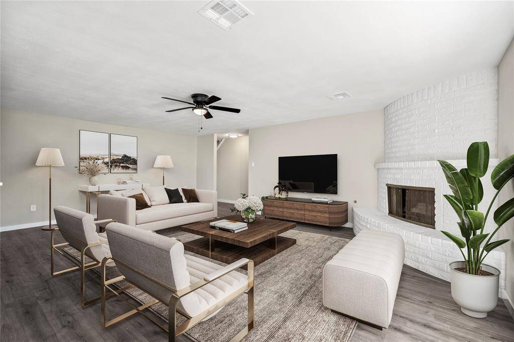 A cozy living room centered around a charming fireplace—perfect for relaxing evenings and creating a space that truly feels like home. *Virtual staging*