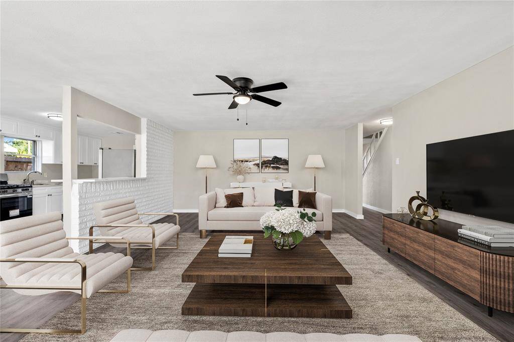 The large layout in the living room provides endless possibilities for furniture arrangement, while the new vinyl flooring adds a modern touch. *Virtual staging*