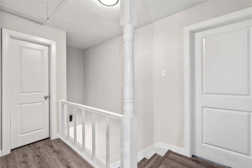 As you step upstairs, the freshly painted walls create a bright, welcoming atmosphere. A spacious storage room adds practical value, offering plenty of room to keep your belongings neatly tucked away.