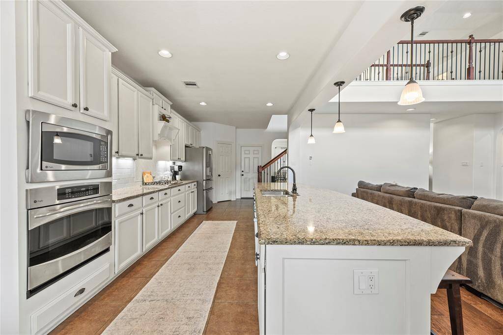 Boasting impressive storage, the center island also features an outlet for easy mixing and prepping with small kitchen appliances. Store cookie cutters and cupcake supplies beneath for impromptu baked goodies, which of course always require an urgent need!