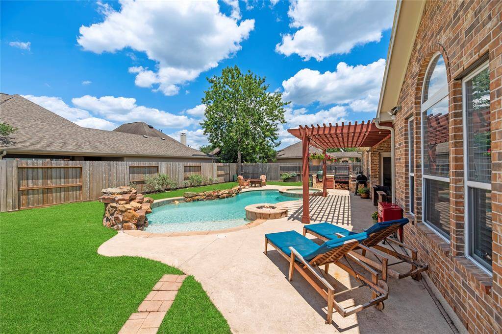 Summertime will be much sweeter with a large fully fenced-in backyard! Frolic, play, and garden in the backyard and bask in the privacy!