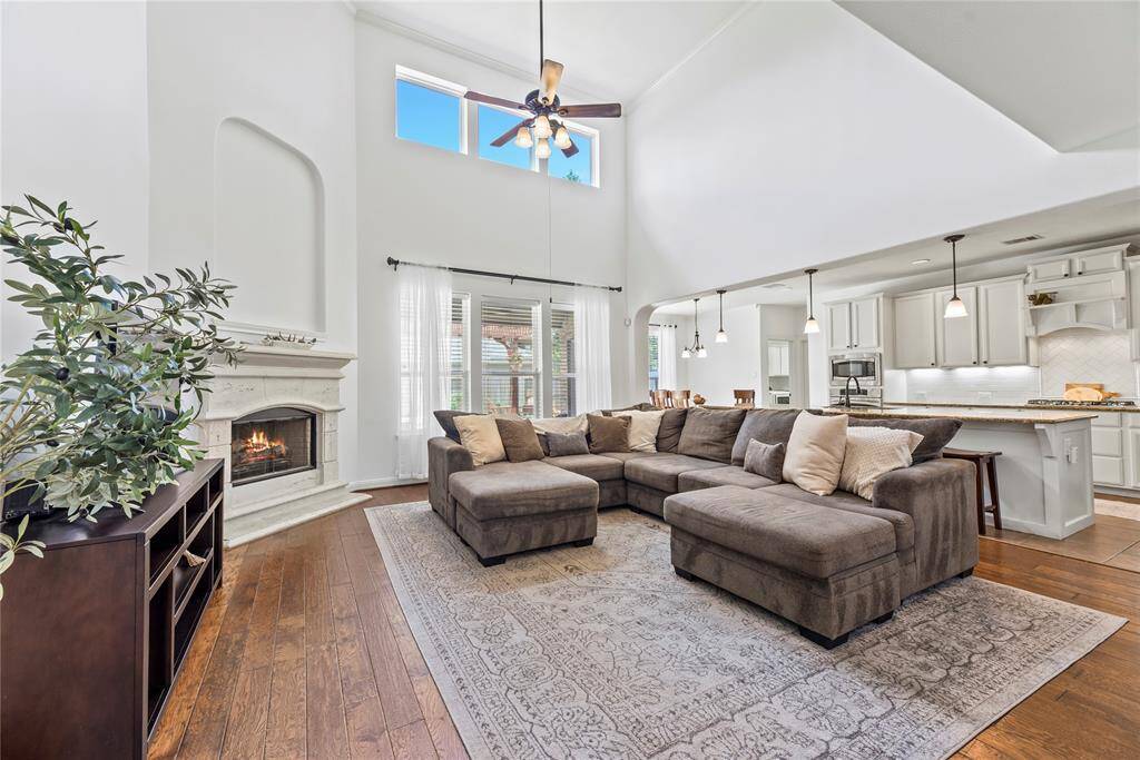Welcoming and conveying warmth, the living room offers an inviting space for evening movies or holiday gatherings. Tune into your favorite streaming show, while admiring the cozy fireplace.