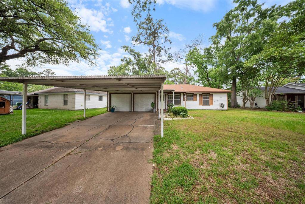 Beautiful home featuring a partially covered driveway for added convenience and curb appeal.