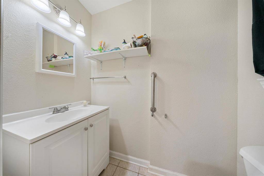 Convenient half bathroom directly connected to the primary bedroom for added privacy and comfort.