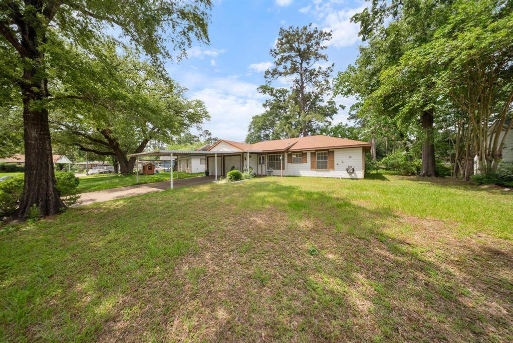 Spacious front lawn ideal for entertaining, gardening, or simply enjoying the outdoors.