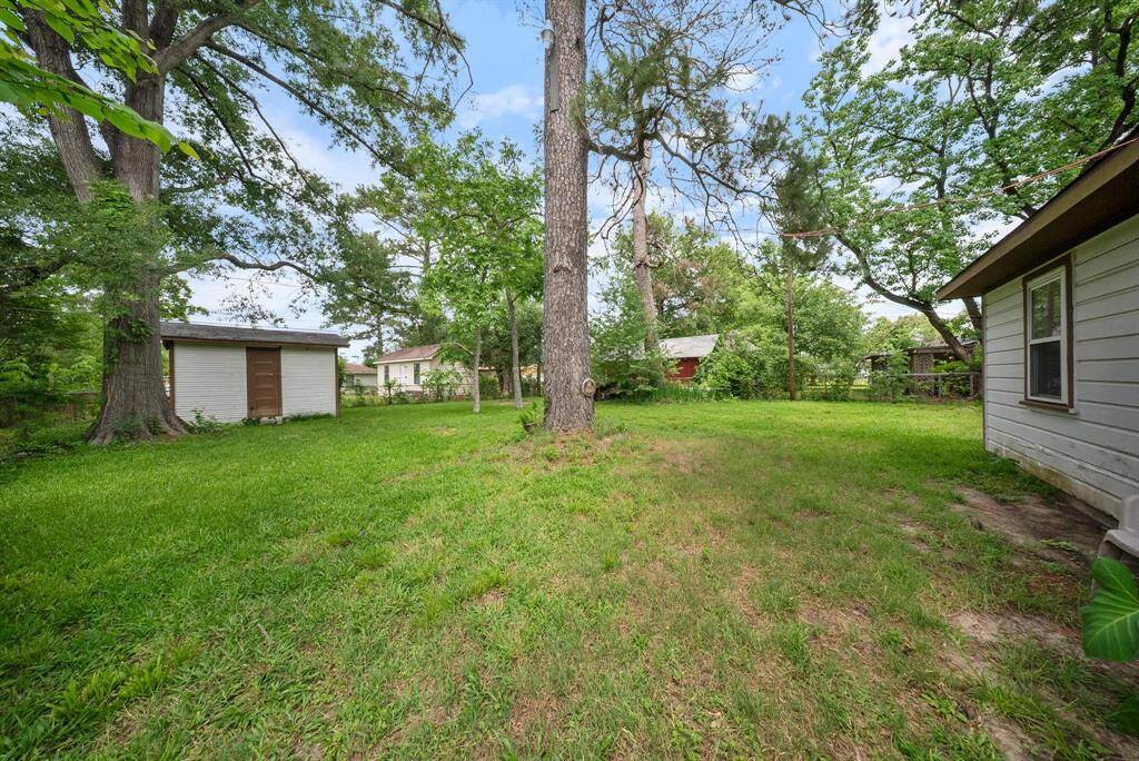 Lovely backyard featuring a convenient shed for all your storage needs.