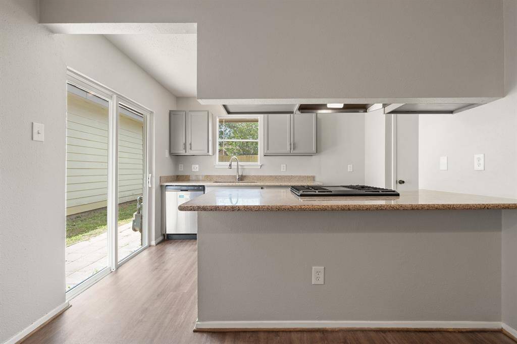 Your chef inspired kitchen awaits! Features include granite countertops, stainless steel appliances, richly painted cabinets with updated hardware, sprawling island with cooktop and breakfast bar seating.