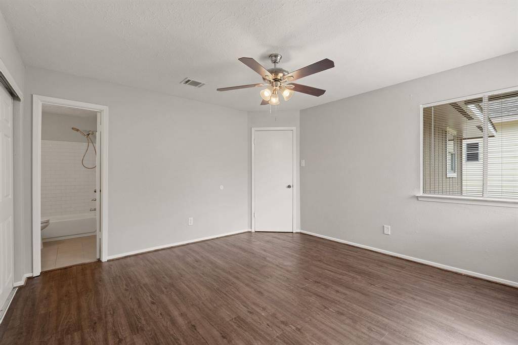 The primary bedroom leads right into your ensuite bath, making it a perfect, cozy space where comfort and convenience meet for a truly relaxing escape.