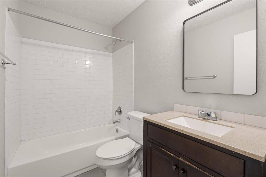 The secondary bathroom is stylishly appointed and thoughtfully designed for comfort and convenience.