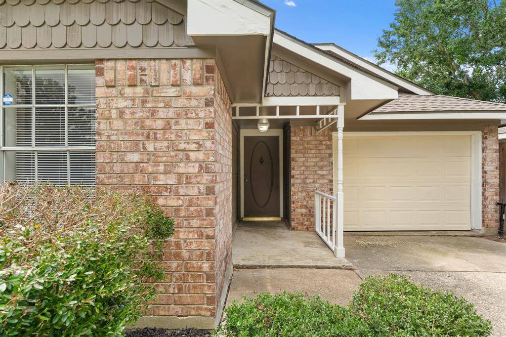 The charming brick-front porch provides the perfect spot to relax and unwind, offering a peaceful place to sit and take in the sights and sounds of the neighborhood.
