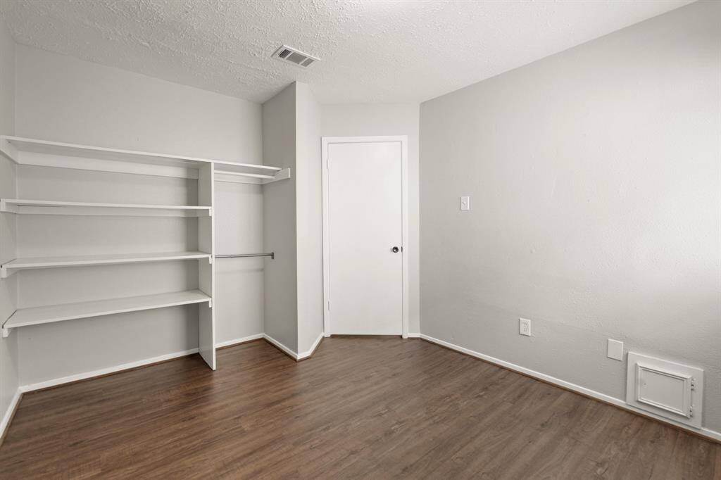 The built-in closet space in the secondary bedroom offers excellent storage and organization.