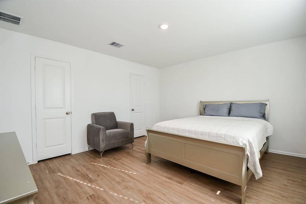 Another view of primary bedroom