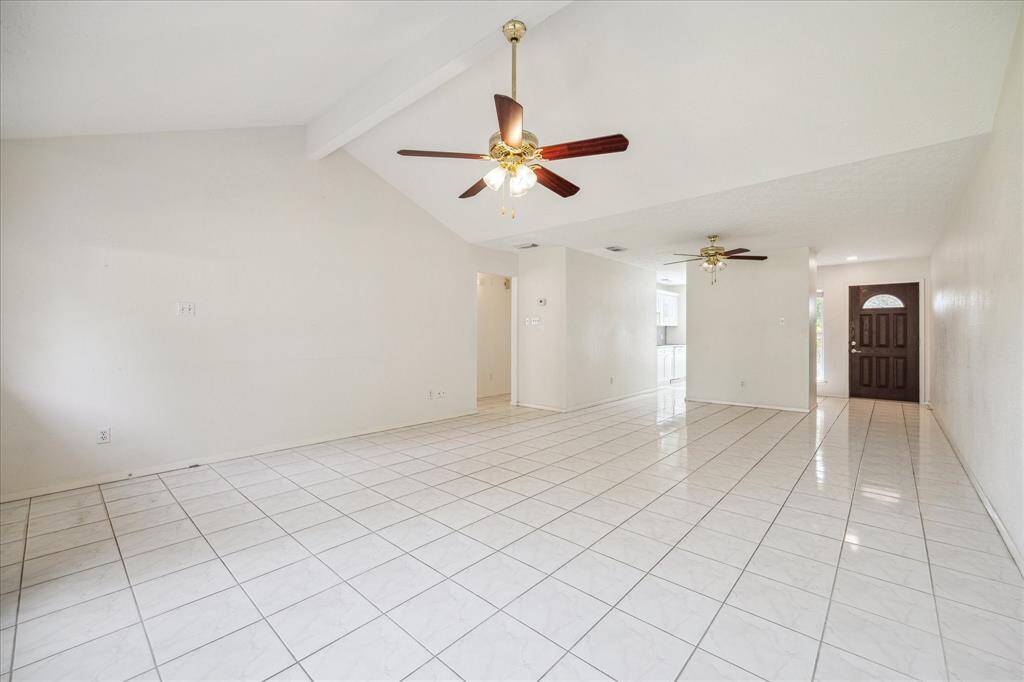 Bright open layout with seamless access to the kitchen and entryway.