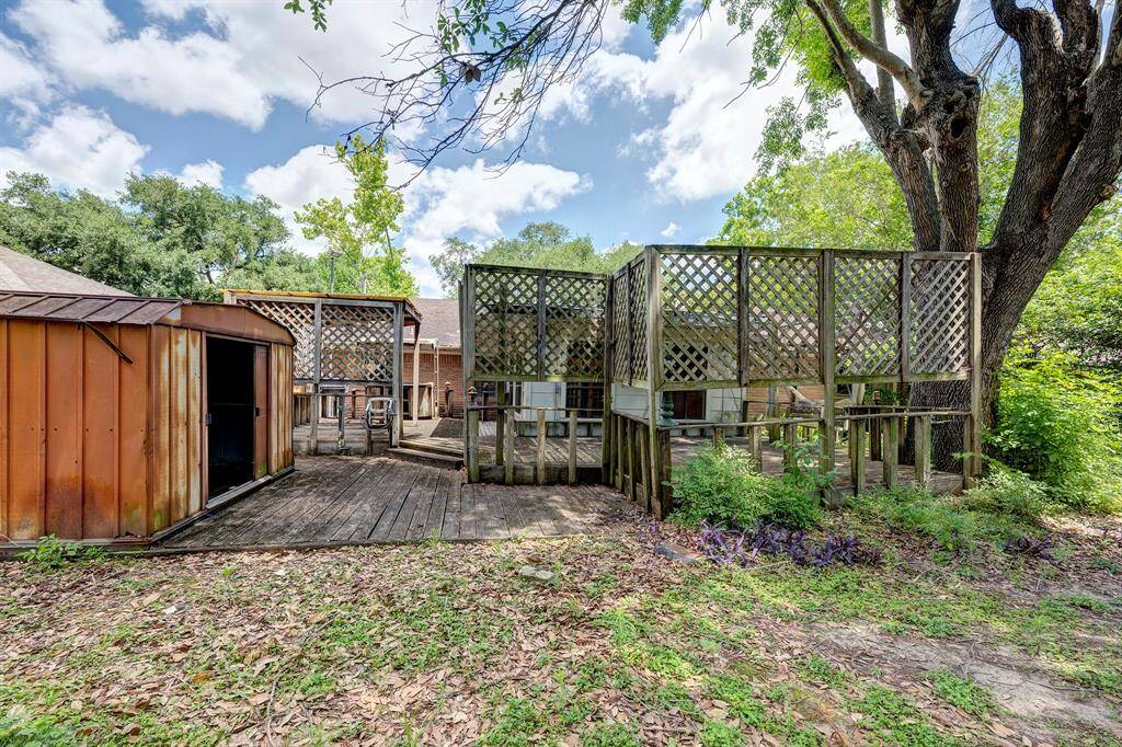 Another look at backyard  with trees shading the property.