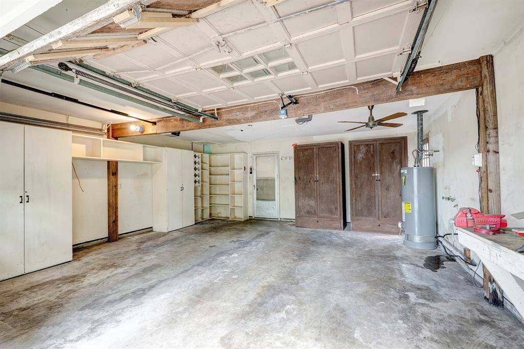 2 car attached garage with extra storage along with attic storage above.
