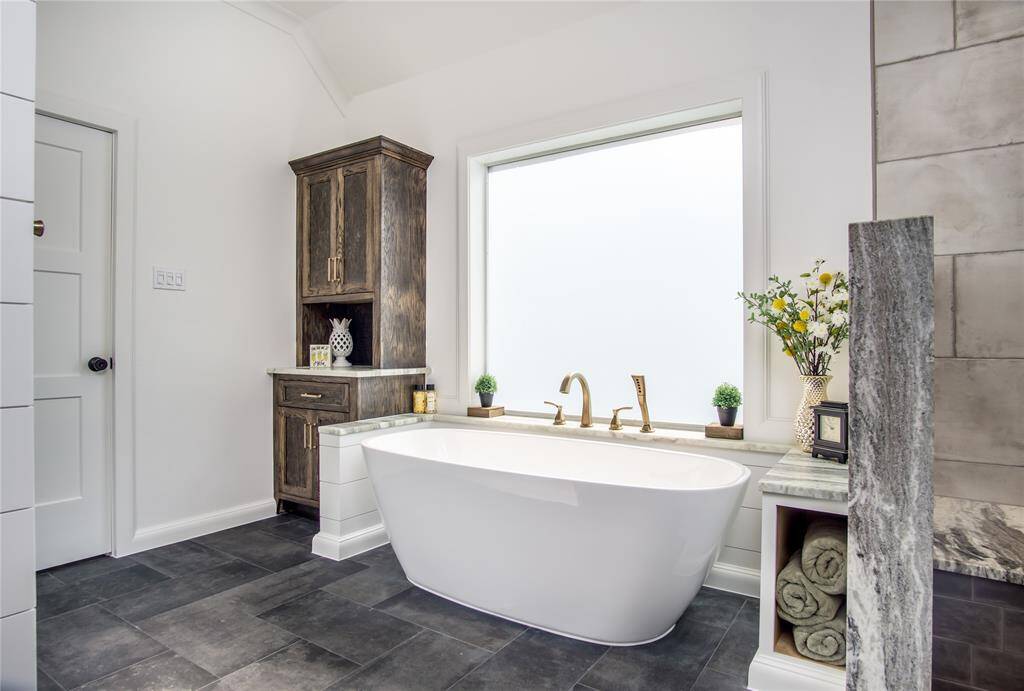 Plenty of storage with the custom-built cabinetry. Soft gold faucets, fixtures, & hardware. Notice the beautiful 3 paneled doors installed in the home.