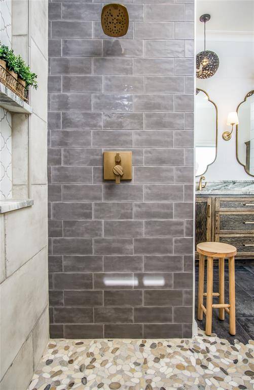 The finishes used in this bathroom come together beautifully to create a high-end, designer space you will love calling your own!