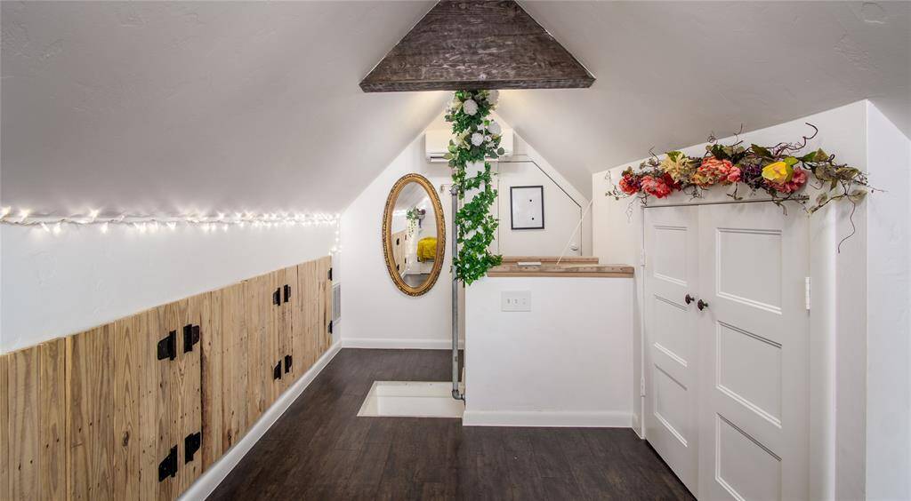 Vinyl plank flooring in this room- no carpeting in the house. Built-in storage areas on both sides of the room. Ductless air conditioner keeps this room temperature controlled!