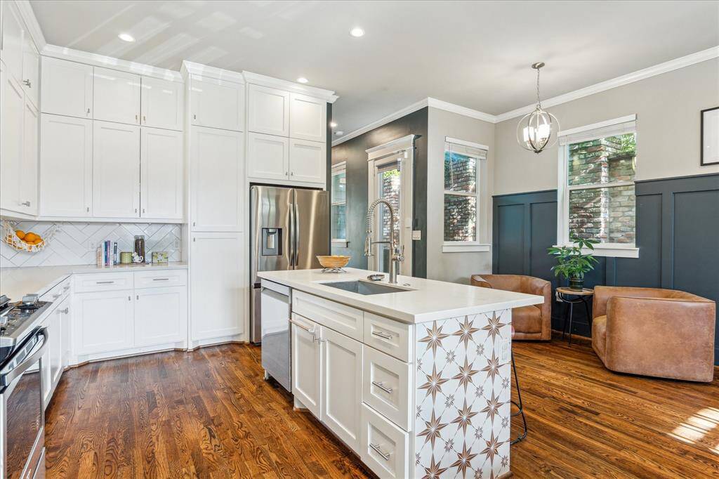 Adjacent to the kitchen is a small sitting space that is perfect for entertaining.