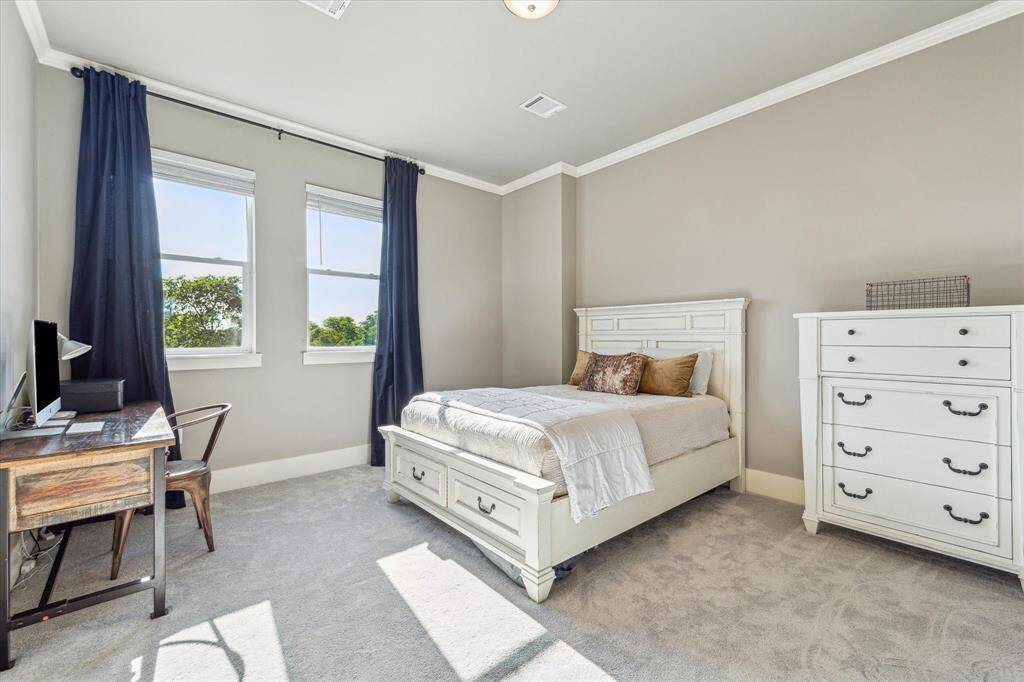 Large fourth bedroom on the 3rd floor provides natural light, neutral walls and new carpet as well as an ensuite bathroom and large walk-in closet.