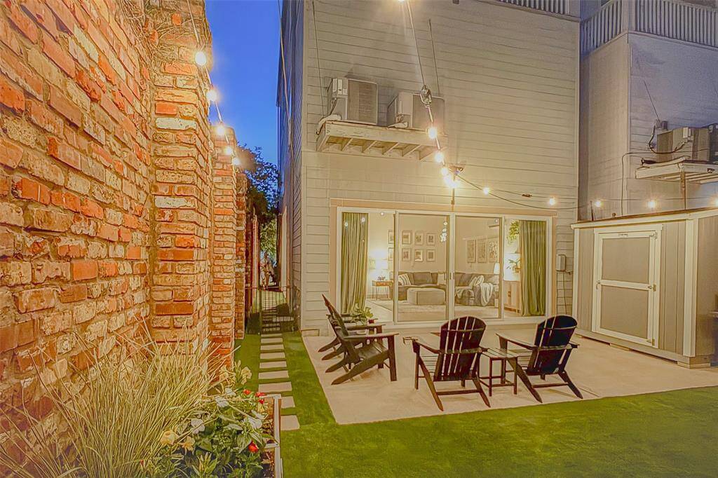 Outdoor lights add to the ambiance and the brick wall provides additional privacy and is a beautiful feature.