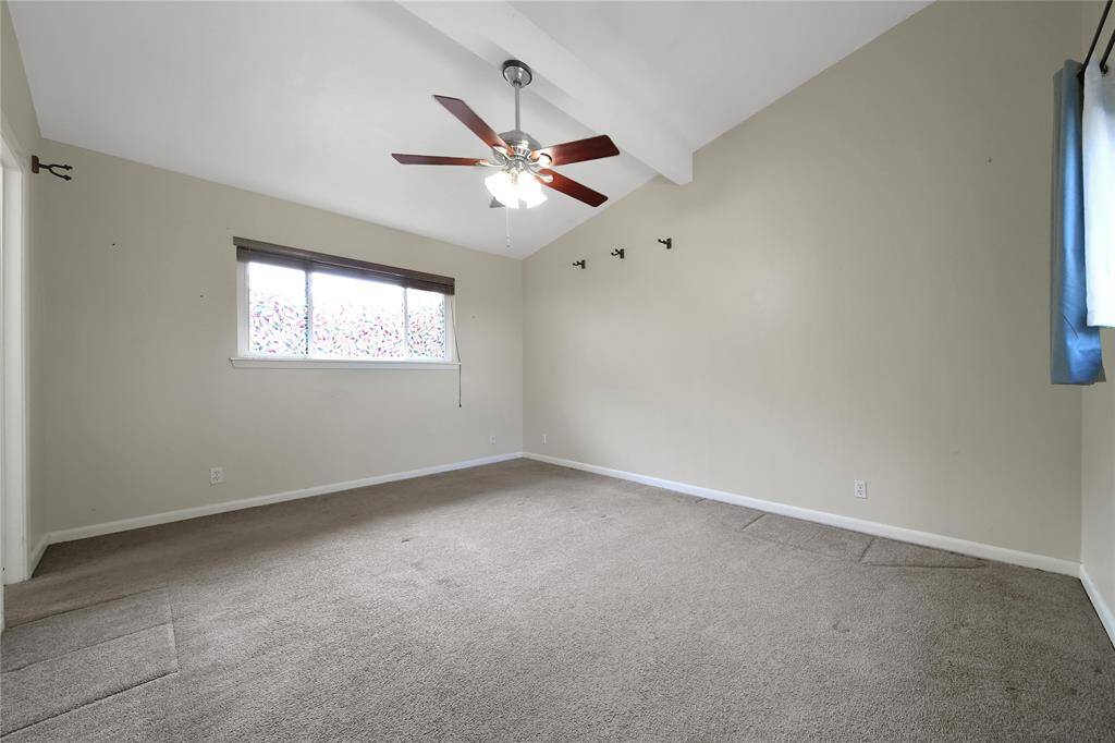 Primary bedroom features ensuite bathroom and high ceilings.