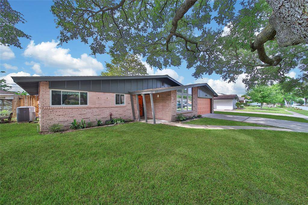 This property features a two car attached garage and beautiful mature trees.